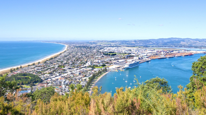 Tauranga, New Zealand. Panoramic view from Mount Maunganui of the white sand beach and City.