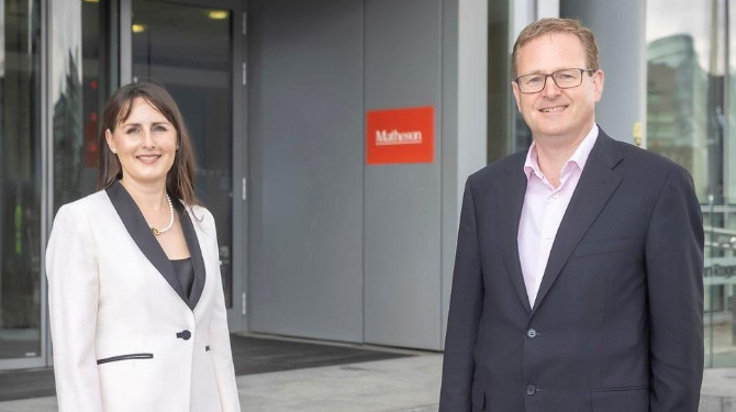 Photograph of Niamh Counihan with Matheson managing partner Michael Jackson standing outside Matheson's offices