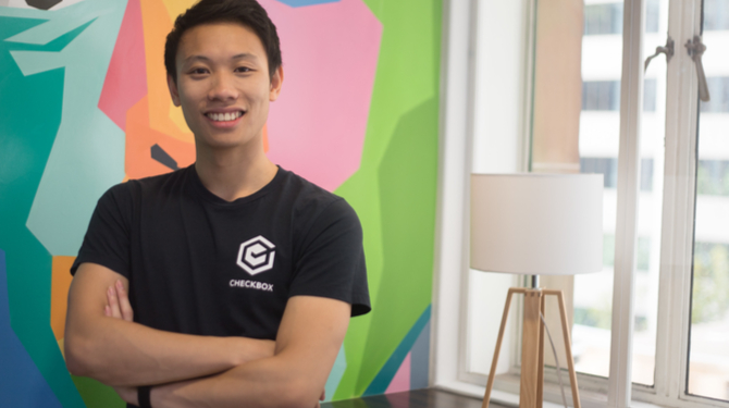 Photograph of Evan Wong in an office