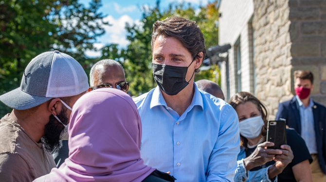 Prime Minister Justin Trudeau greets bystanders after a press conference at the Eva James Memorial Community Centre in Kanata.