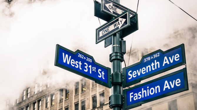 Modern street sign and vapor steam in New York City - Urban concept and road traffic directions in Manhattan downtown - American world famous capital destination on dramatic desaturated filtered look