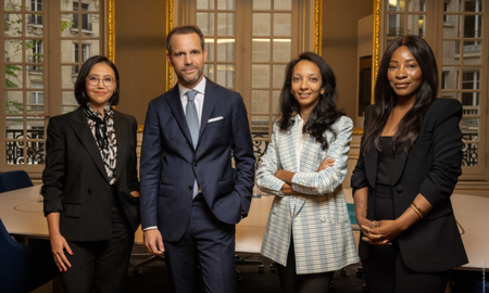 Photograph in the office of Guillaume Panuel with his team of associates (l-r) Agathe Marcelin, Houda Bourrich and Bréa Kamtcheu.