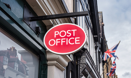 Windsor, UK- Feb 10, 2020: Post Office Sign outside a post office in Windsor