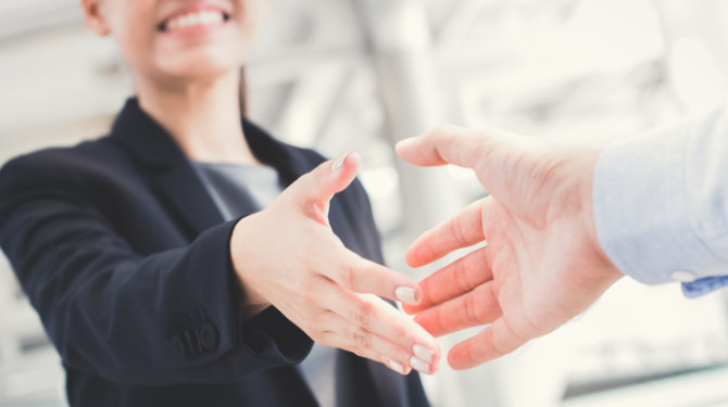 People shaking hands after a job offer