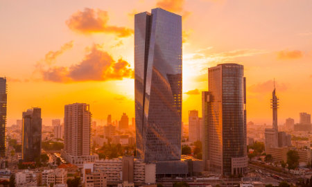 A photo of the Tel Aviv skyline at sunset