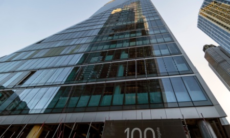 CITY OF LONDON, UK - SEPTEMBER 27, 2018:  Reflection of Heron Tower skyscraper in 100 Bishopsgate surrounded by other tall buildings