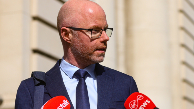 Irish Minister for health Stephen Donnelly speaks to the media as he arrives at Government buildings in Dublin.