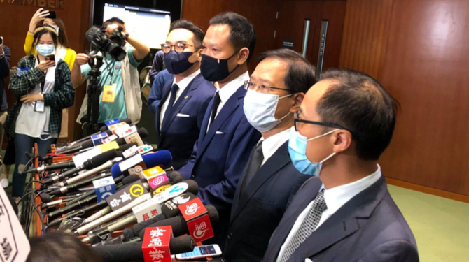 Dennis Kwok (second from left) at a press conference with the other disqualified law makers